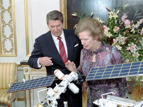 president ronald reagan and margaret thatcher viewing model of manned space station at lancaster house in london